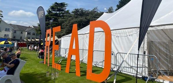 A large sign that spells out READ next to a white marquee.